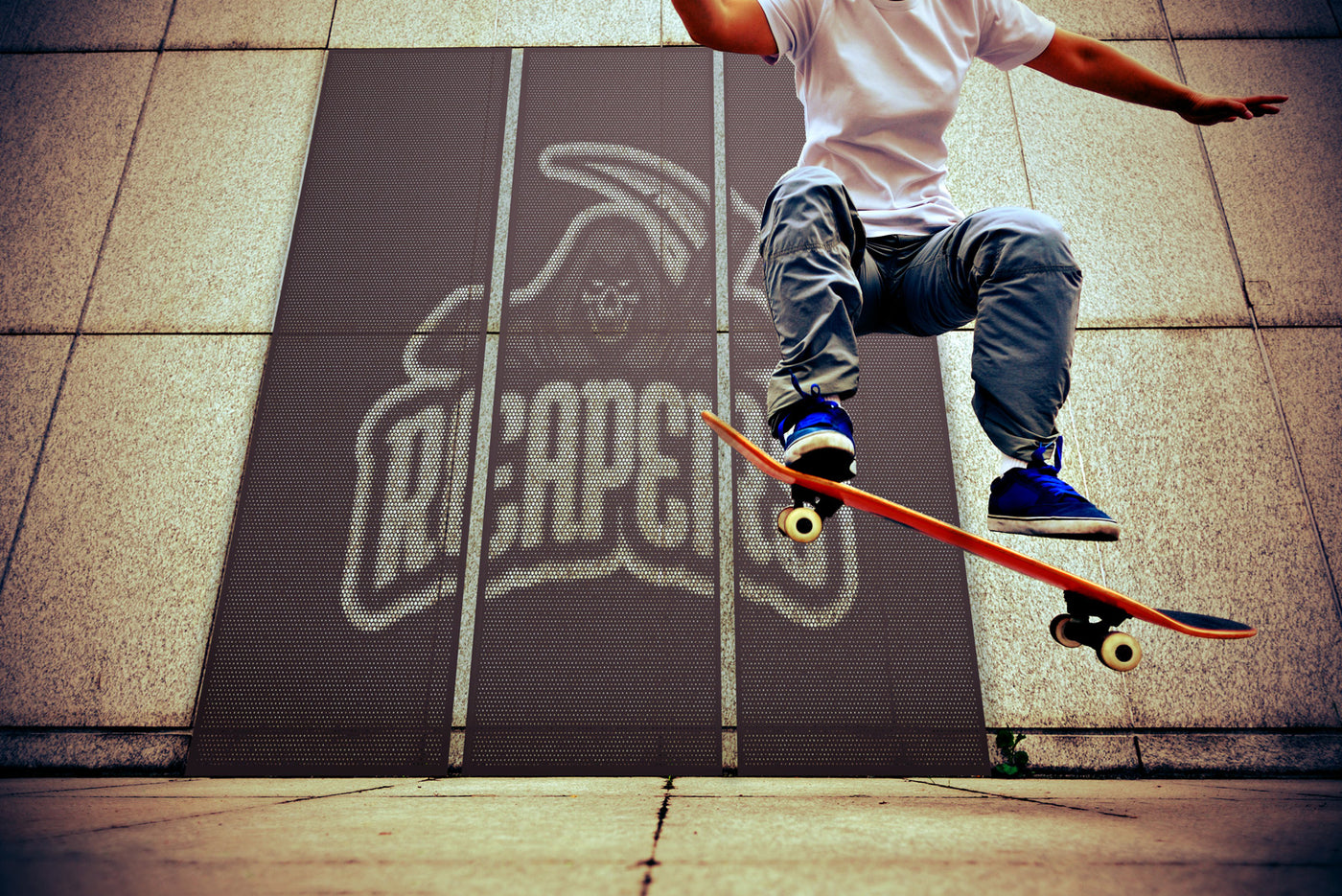 web Logo on perforated metal design with skateboarder